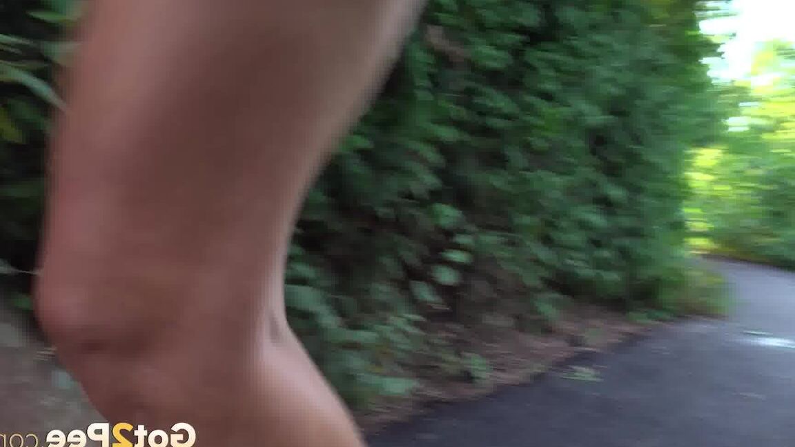15P Blonde teen Daisy Lee takes a piss on a paved path through the woods
