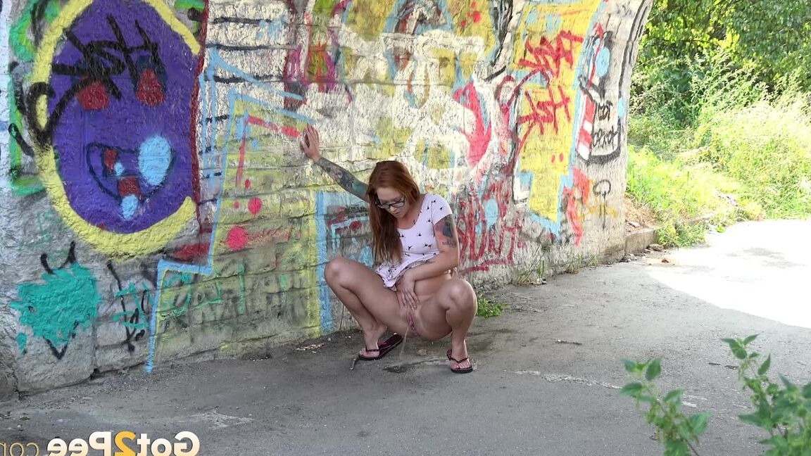 15P Redhead in glasses pees under a bridge
