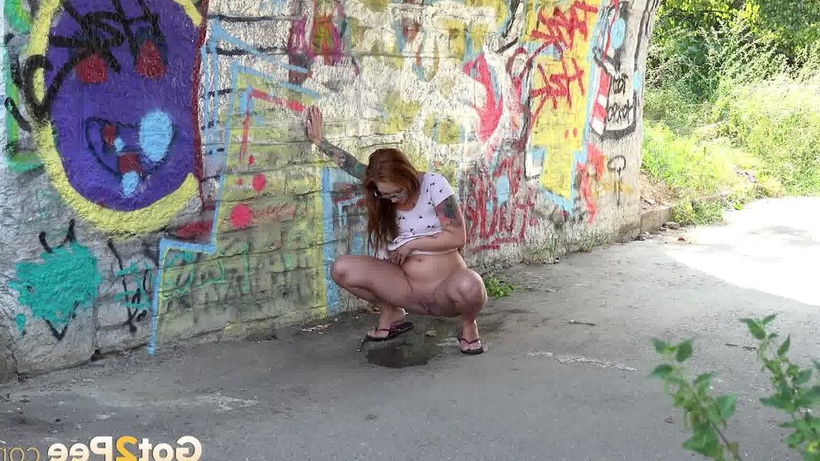 15P Redhead in glasses pees under a bridge