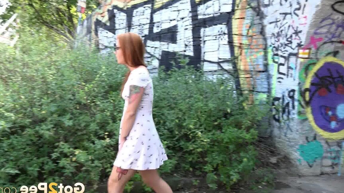15P Redhead in glasses pees under a bridge