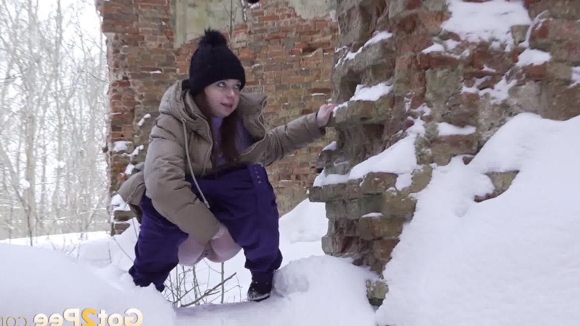 15P Cute brunette squats to piss in the snow
