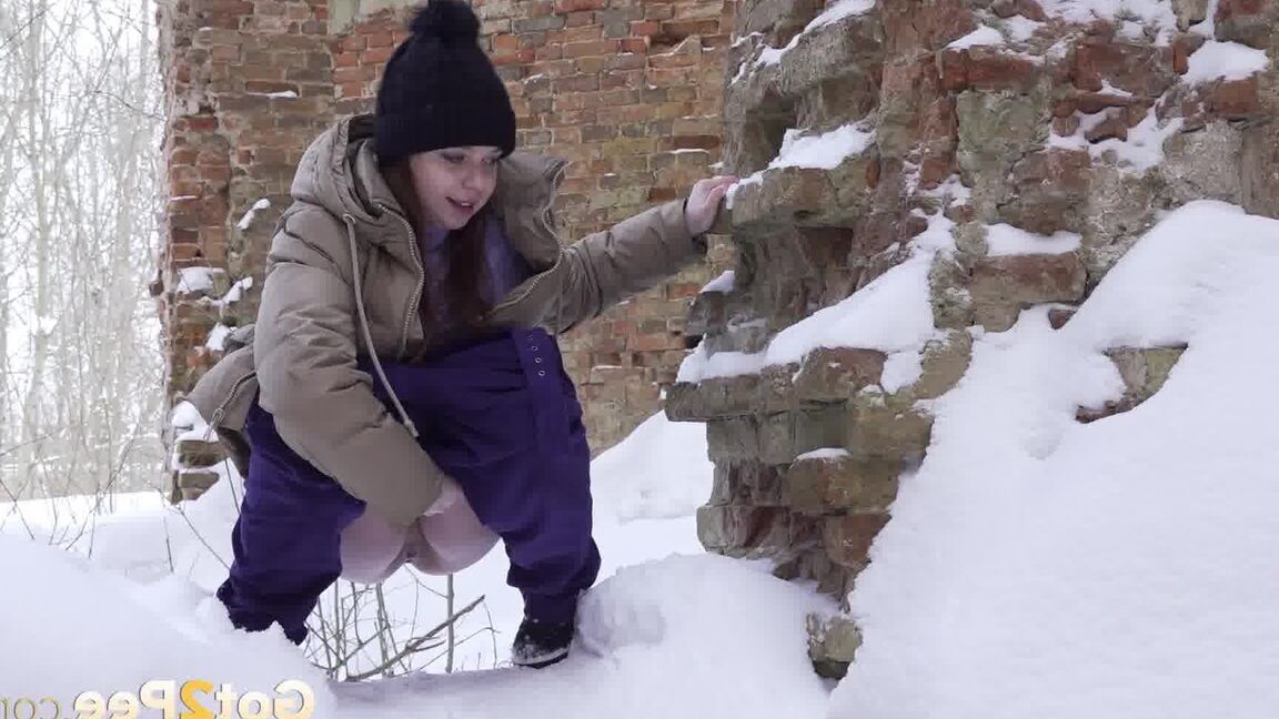 15P Cute brunette squats to piss in the snow
