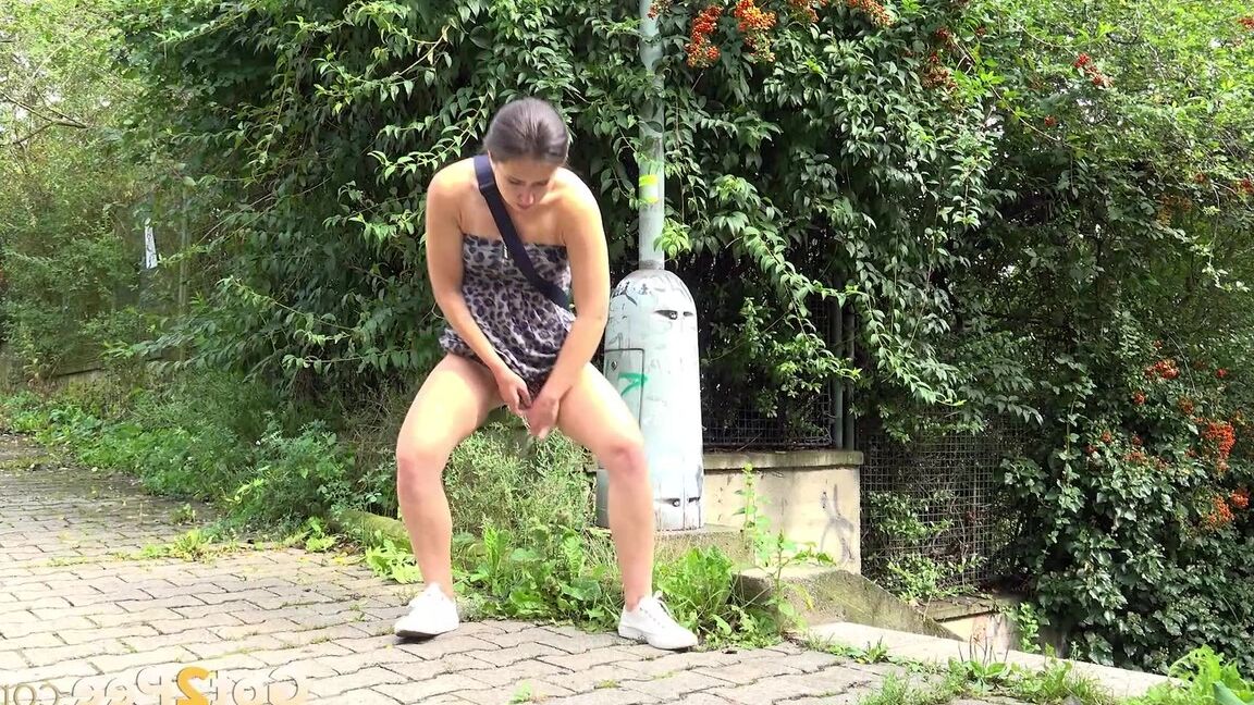 15P White girl Lara Fox takes a piss on a brick sidewalk after ascending stairs