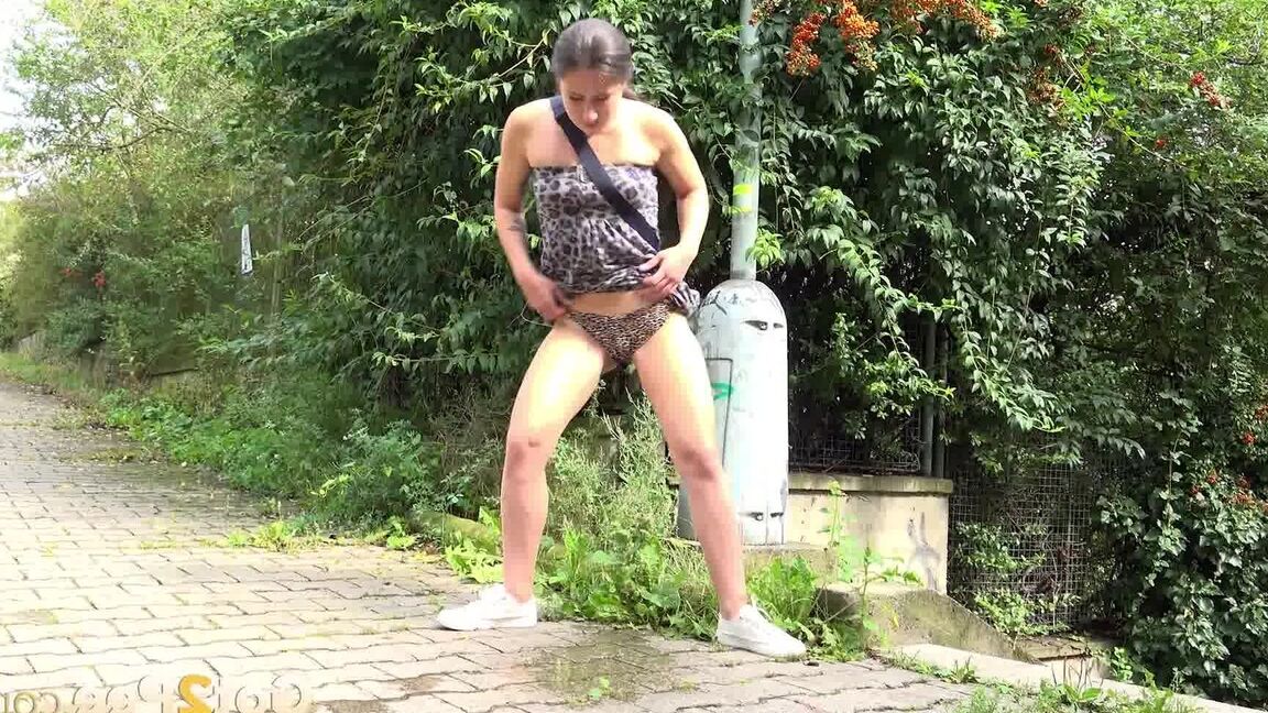 15P White girl Lara Fox takes a piss on a brick sidewalk after ascending stairs