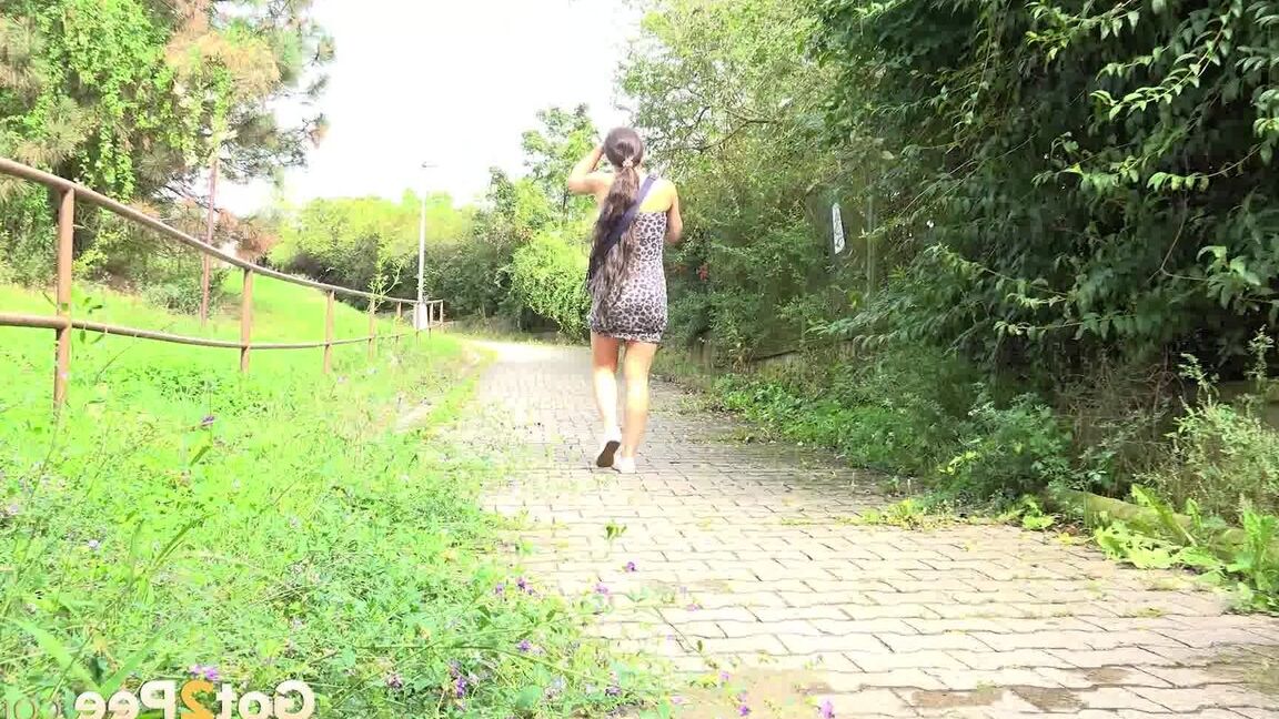 15P White girl Lara Fox takes a piss on a brick sidewalk after ascending stairs