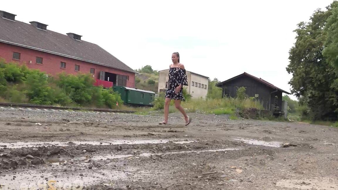 15P Sexy brunette Yenna squats and pees in a puddle