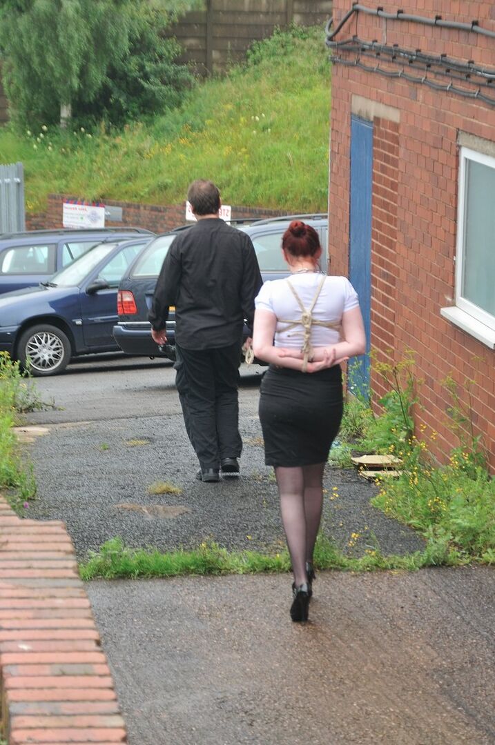 16P Redhead licks her Master's boots in parking lot before crawling on all fours