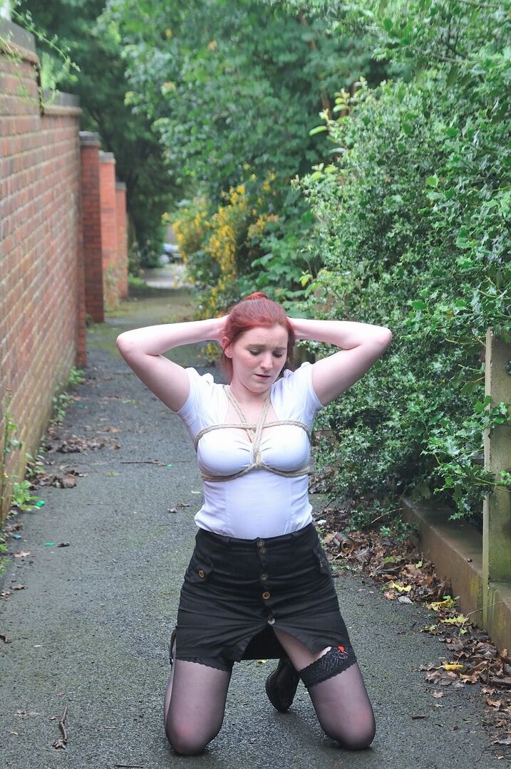 16P Redhead licks her Master's boots in parking lot before crawling on all fours