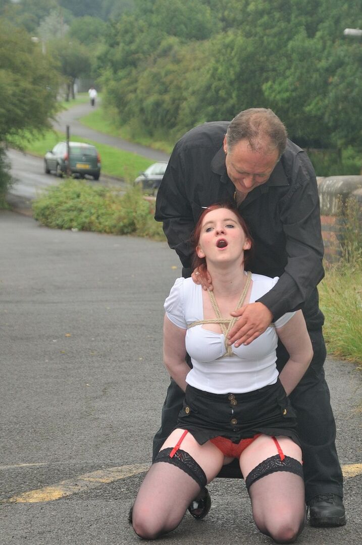 16P Redhead licks her Master's boots in parking lot before crawling on all fours
