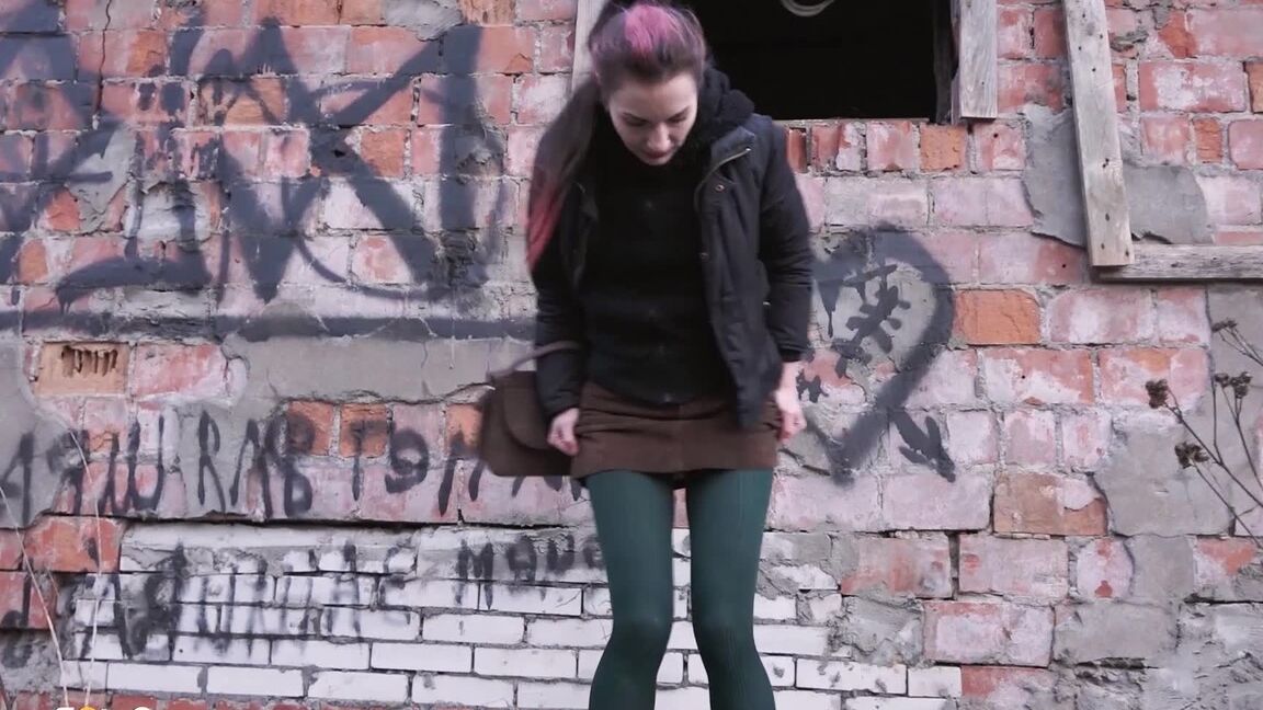 15P Caucasian girl pulls down her tights for a piss behind an abandoned building