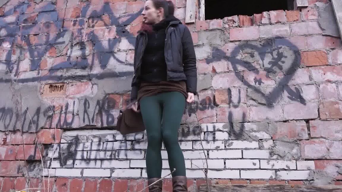 15P Caucasian girl pulls down her tights for a piss behind an abandoned building