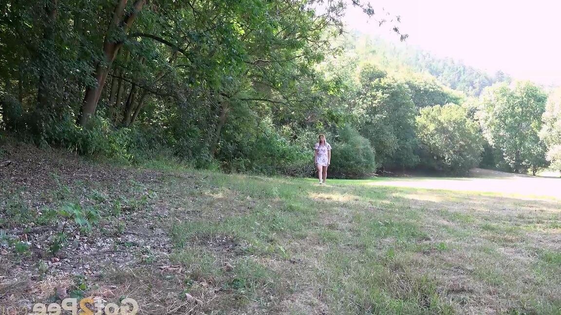 15P White girl Nikki Dream takes a piss in a field while out for a walk
