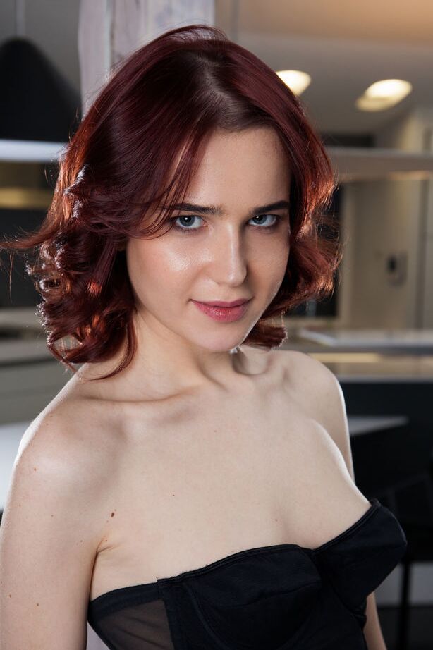 16P Redhead Emi shows off slender creamy body with pink puff nipples as she