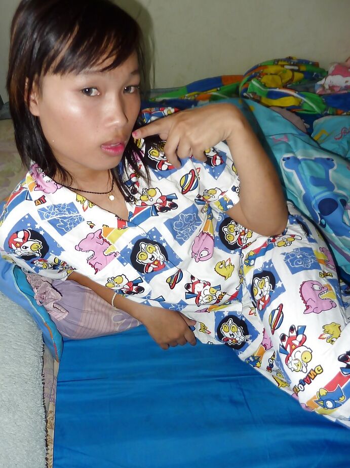 16P Slim Asian shemale strips nude and bares tiny tranny tits while jacking off