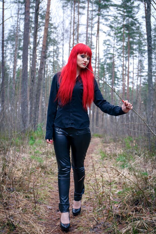 16P Redhead Ferggy pulls down leather pants to get at her horny cunt in the woods