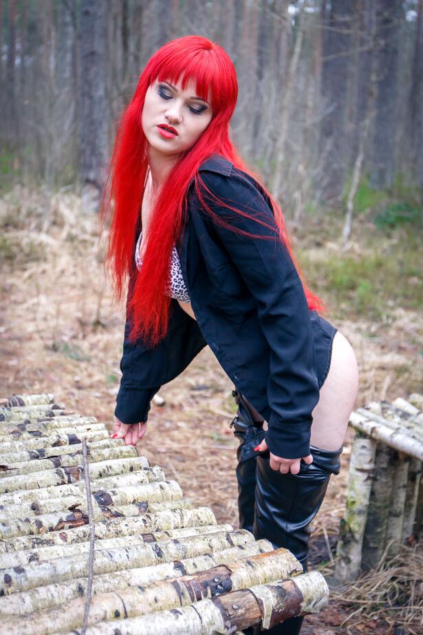 16P Redhead Ferggy pulls down leather pants to get at her horny cunt in the woods