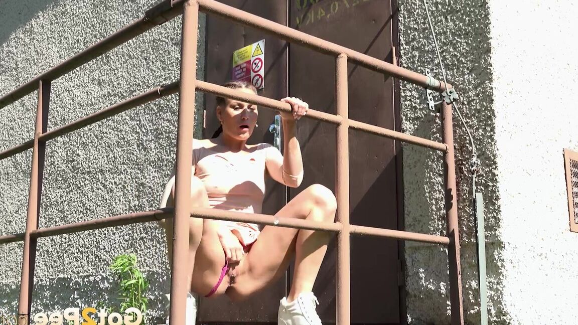 15P Distressed girl Yenna takes a piss on concrete steps outside a locked door
