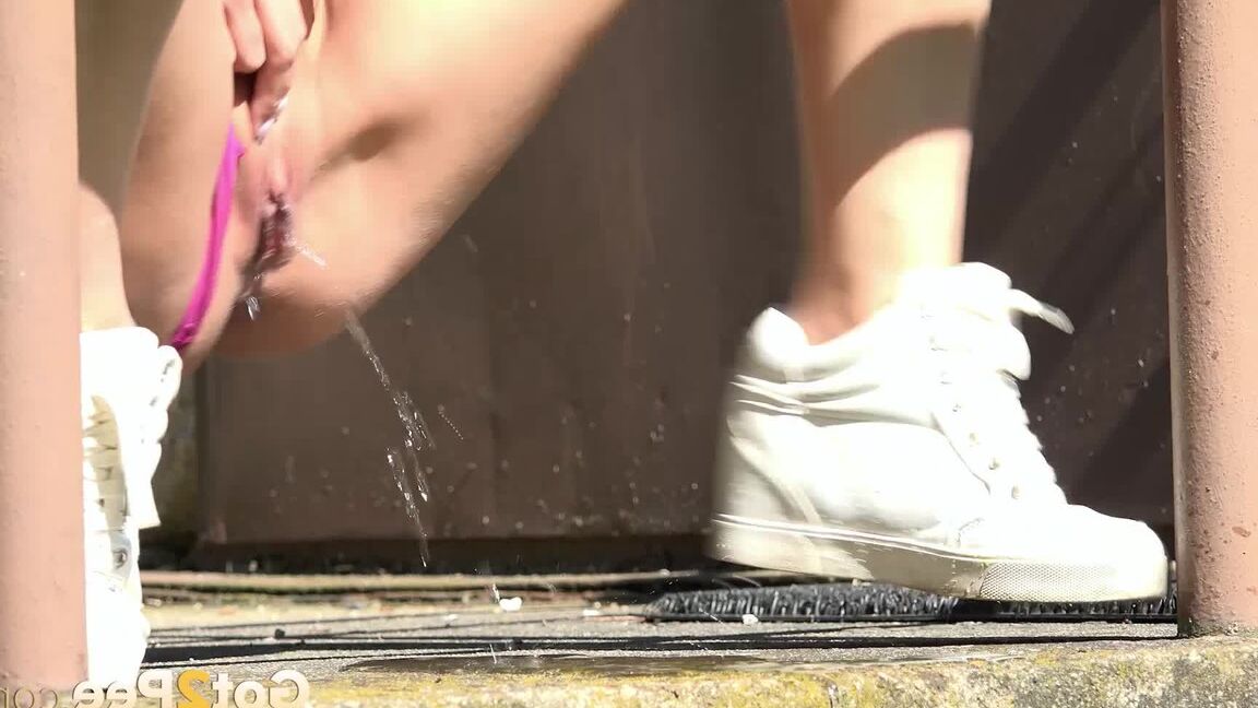 15P Distressed girl Yenna takes a piss on concrete steps outside a locked door