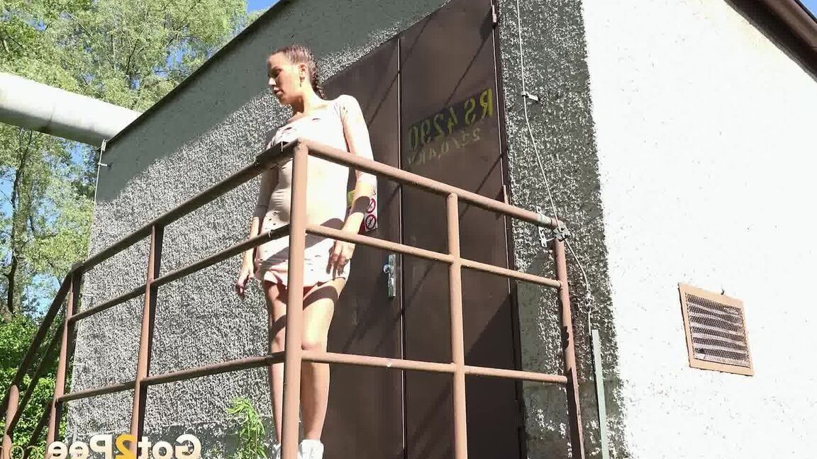 15P Distressed girl Yenna takes a piss on concrete steps outside a locked door