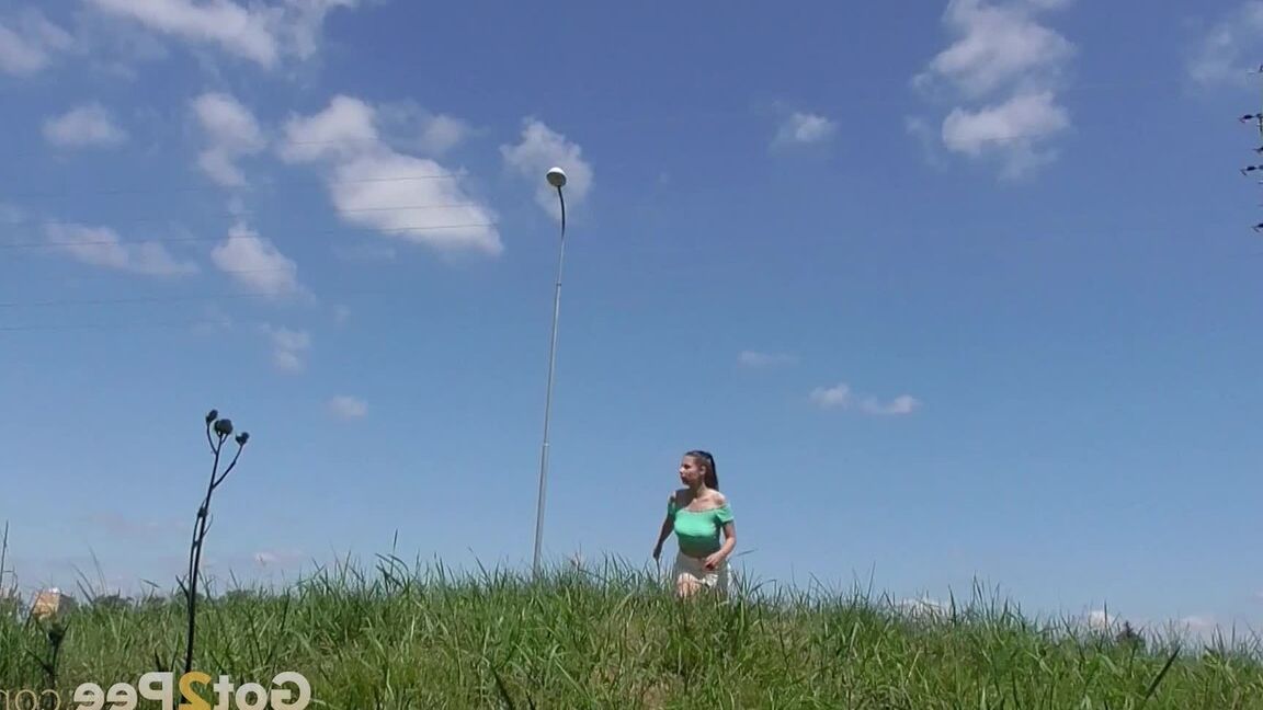 15P Solo girl Antonia Sainz takes a piss on a grassy knoll while all alone