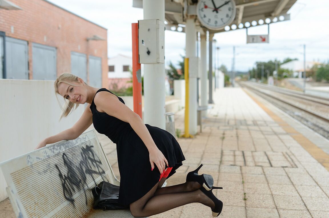 21P Kinky MILF Aston inserts glasses in her cunt while waiting for a train to come