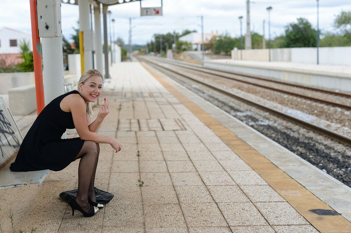 21P Kinky MILF Aston inserts glasses in her cunt while waiting for a train to come