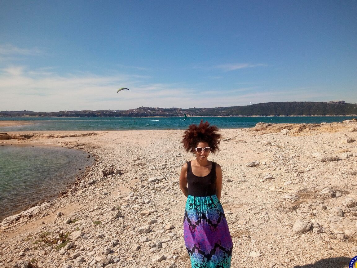 21P Mature ebony with hairy armpits Divine reveals her bushy cunt on the beach
