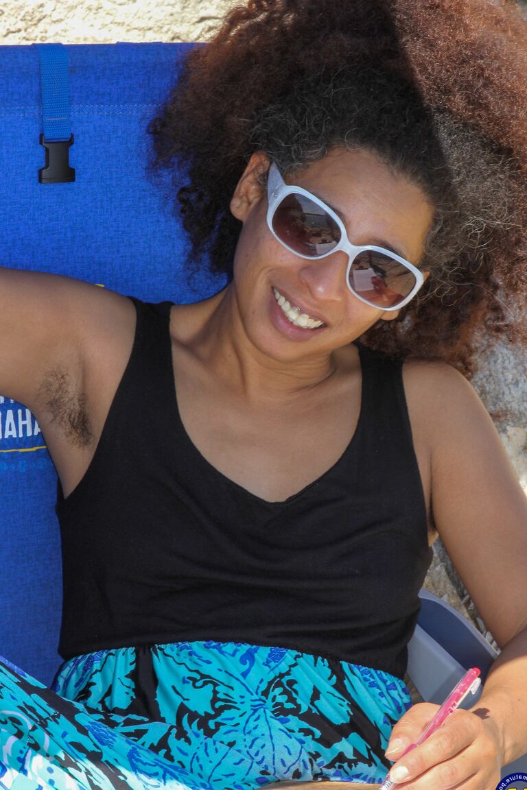 21P Mature ebony with hairy armpits Divine reveals her bushy cunt on the beach