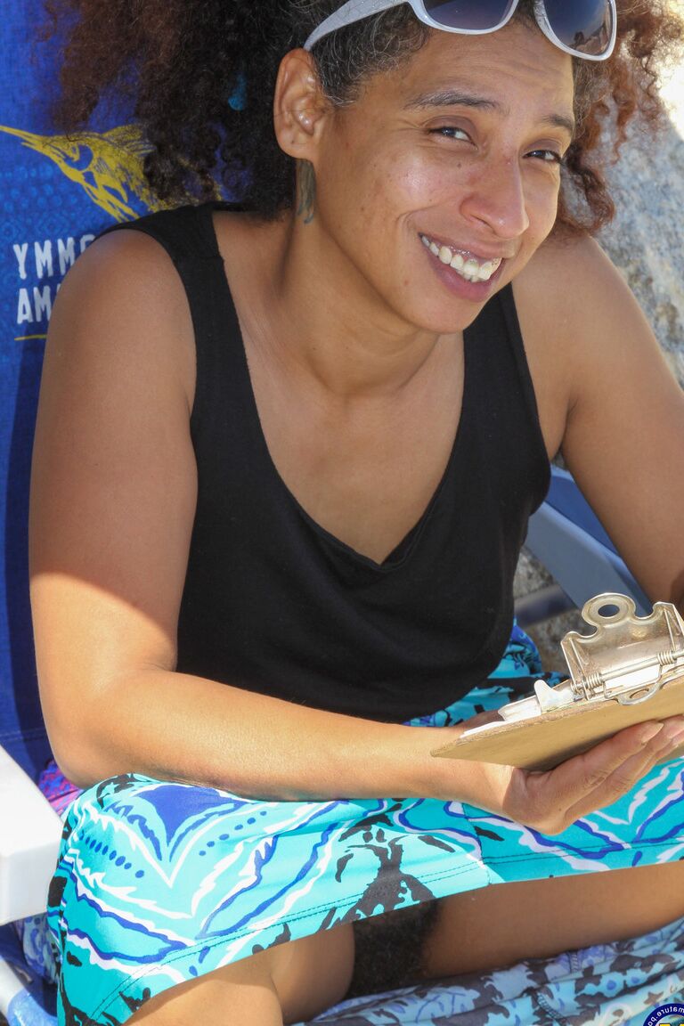 21P Mature ebony with hairy armpits Divine reveals her bushy cunt on the beach