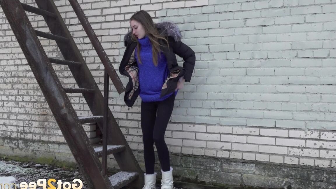 15P Caucasian girl pulls down her leggings to take a piss on snow-covered ground