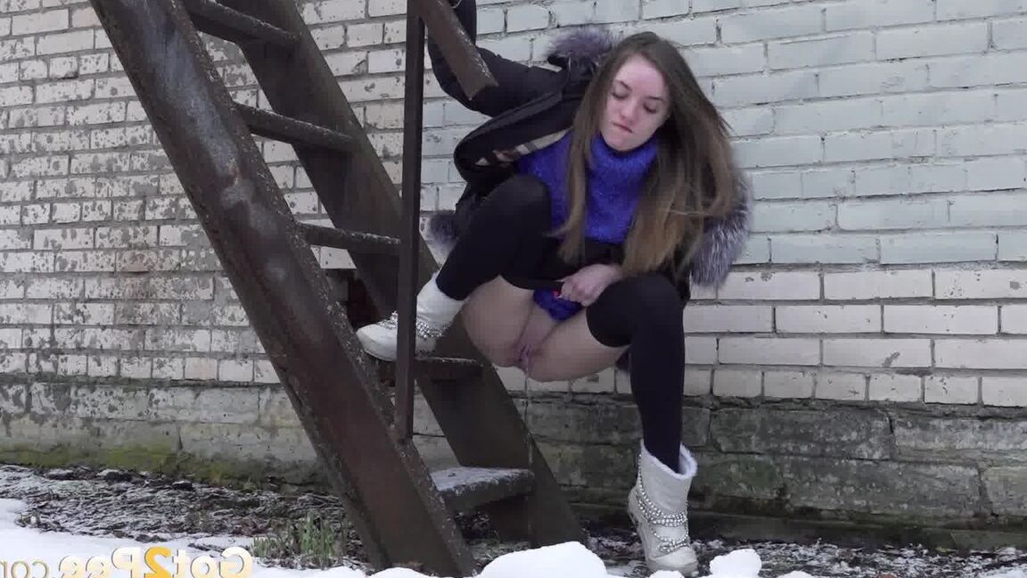 15P Caucasian girl pulls down her leggings to take a piss on snow-covered ground