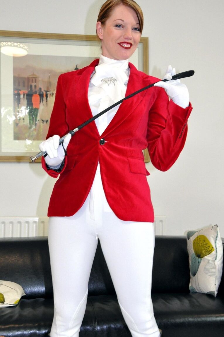 15P Sexy redhead Holly wears her riding attire while having sex with an old man
