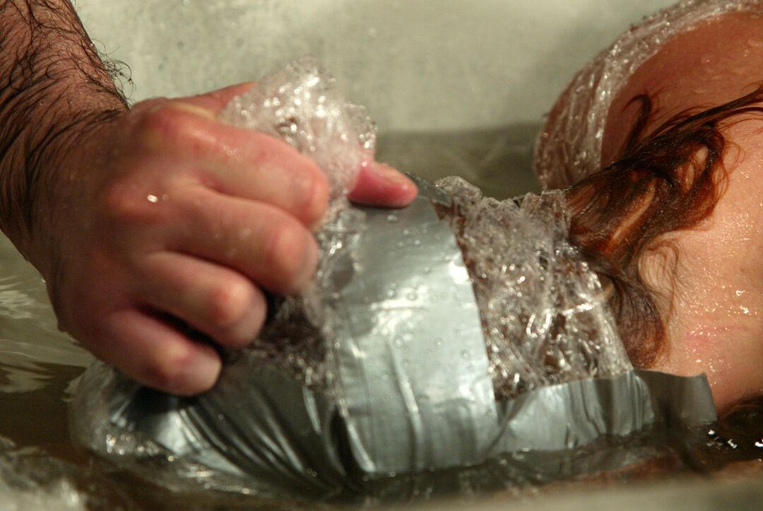 21P Slutty Ivy gets bound in plastic & duct tape for intense water bondage action