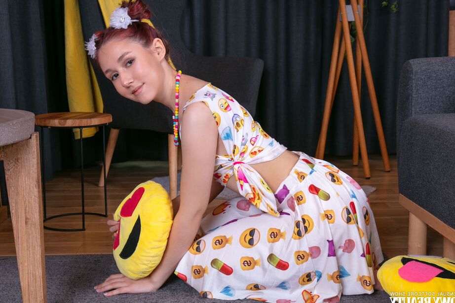 20P Young looking redhead Lexi gets naked while sporting puffballs