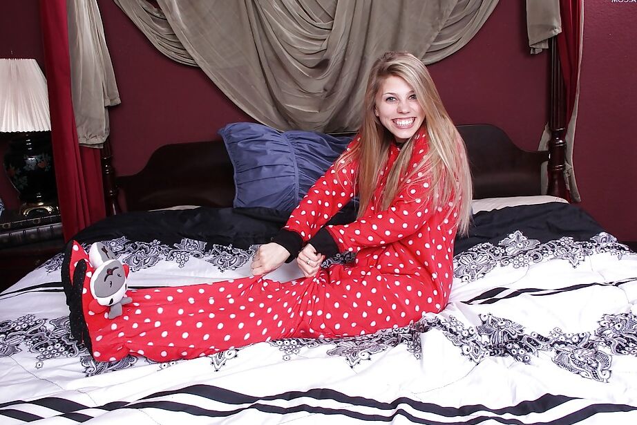 16P Young first timer Kassie Kensington removing her pajamas to model nude on bed