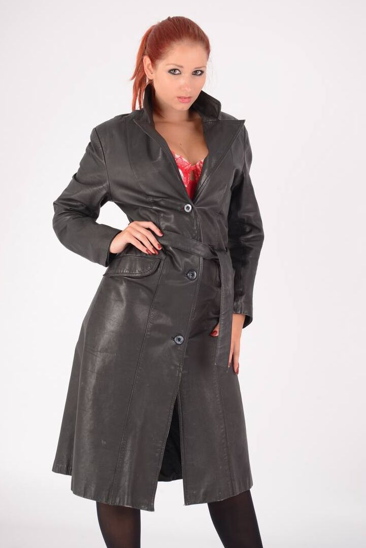 15P Natural redhead undoes a long leather coat to expose tan lined breasts