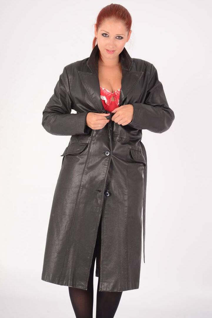 15P Natural redhead undoes a long leather coat to expose tan lined breasts
