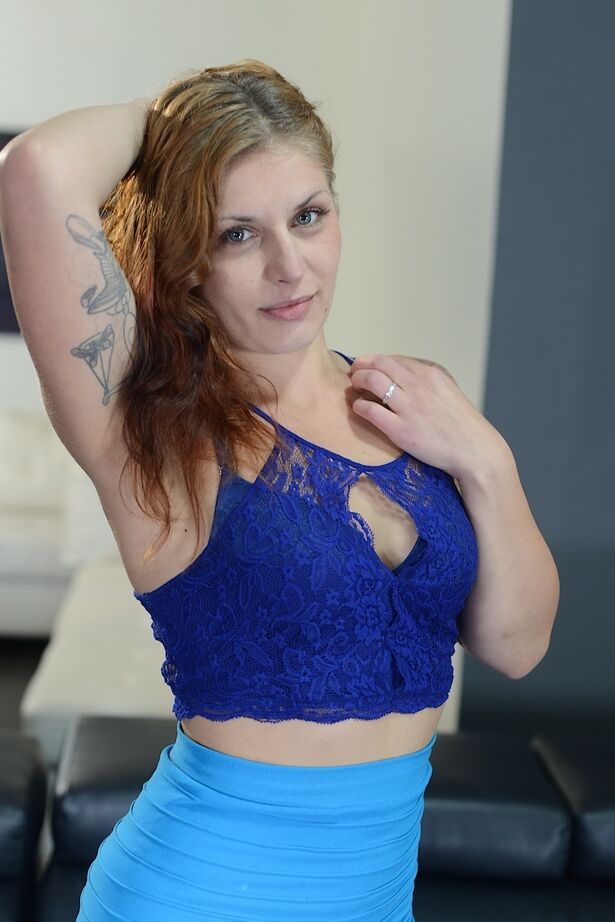 16P Redhead model Fallon West slips off skirt and panties to model naked