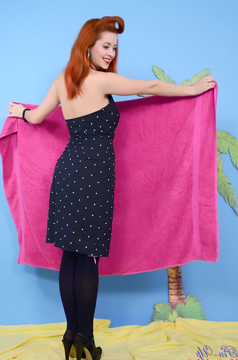 17P Redhead pinup model Lucy V sets her perfect tits free in OTK nylons