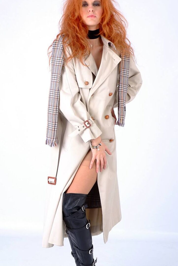 15P Redhead model Chiara doffs trench coat to model in OTB boots and nylons