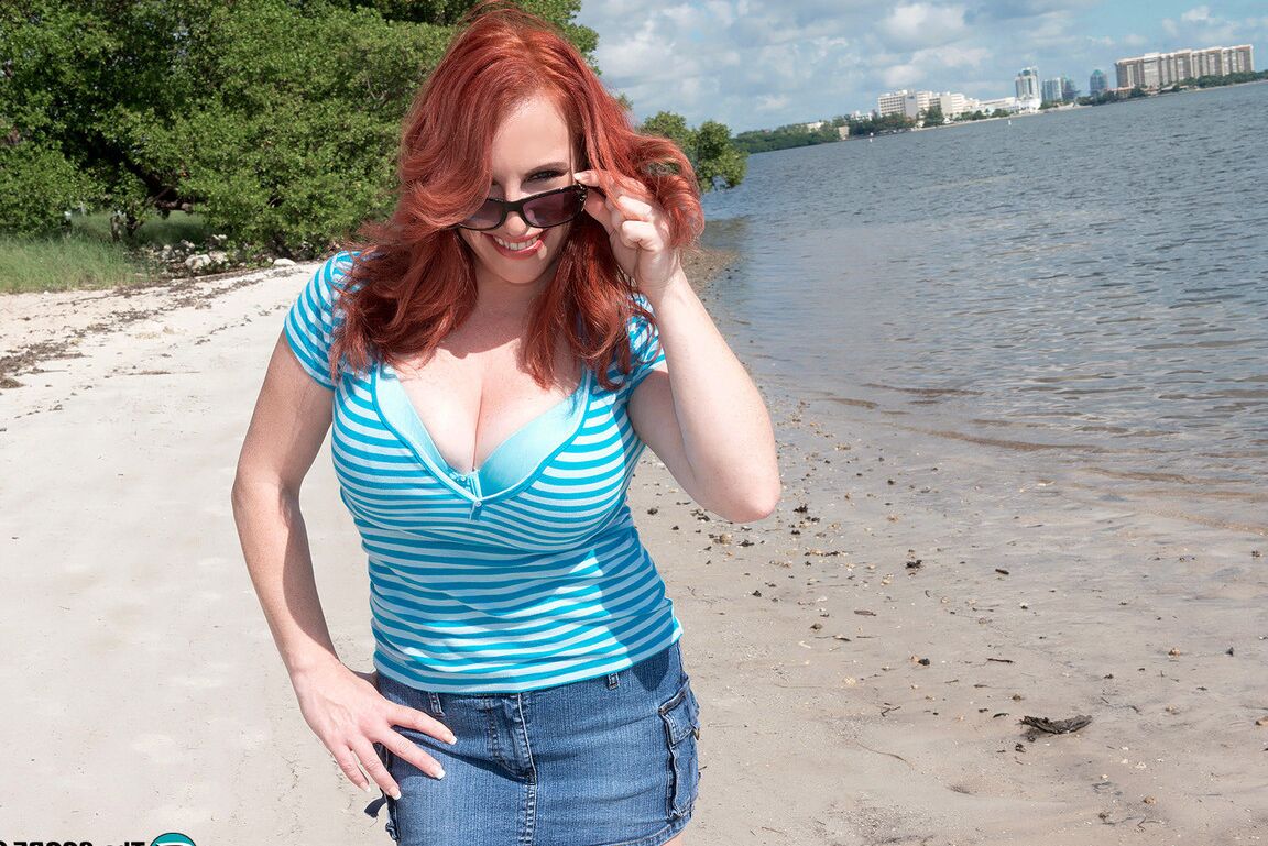 16P Natural redhead Red Vixen releases her big tits from a bathing suit in shades