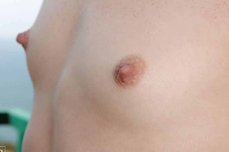 16P Thin redhead Elle Alexandra takes off her bikini top utdoors