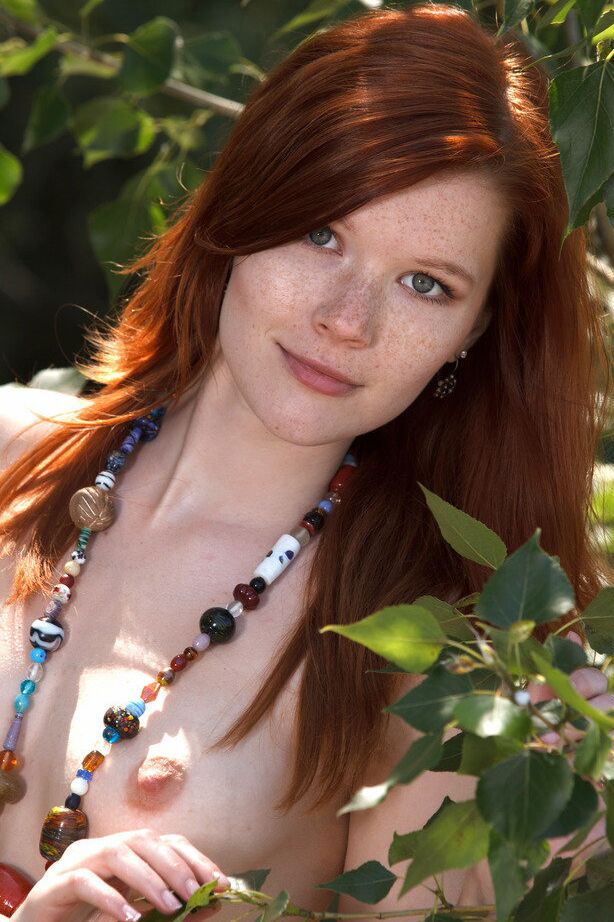 18P Hot redhead Mia Sollis frees her teen body from a swimsuit in a brook