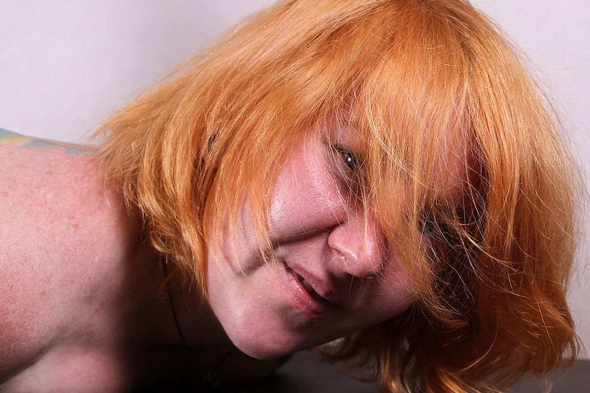 16P Tattooed redhead Florencce is hogtied and toetied on a massage table
