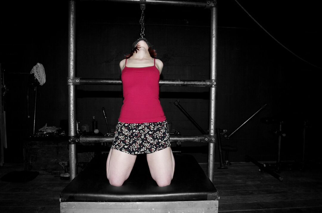 19P Redheaded MILF Sabrina Sparx gets stripped while tied to a metal construction