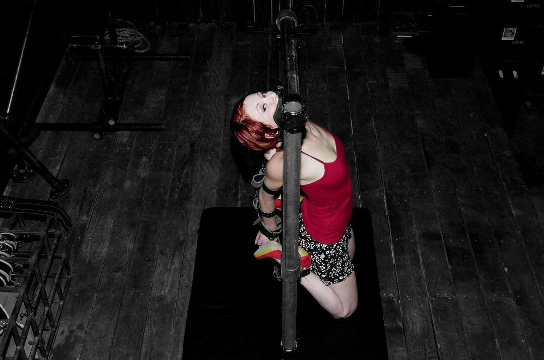 19P Redheaded MILF Sabrina Sparx gets stripped while tied to a metal construction