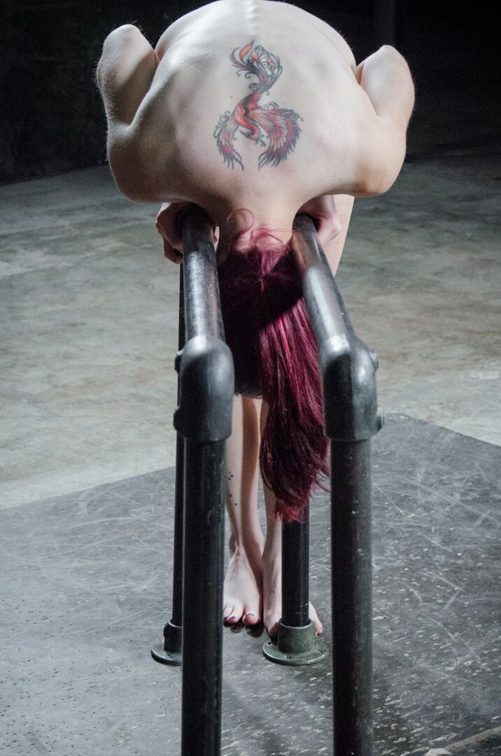 14P Naked redhead Ivy Addams sports cane marks on her ass while in bondage