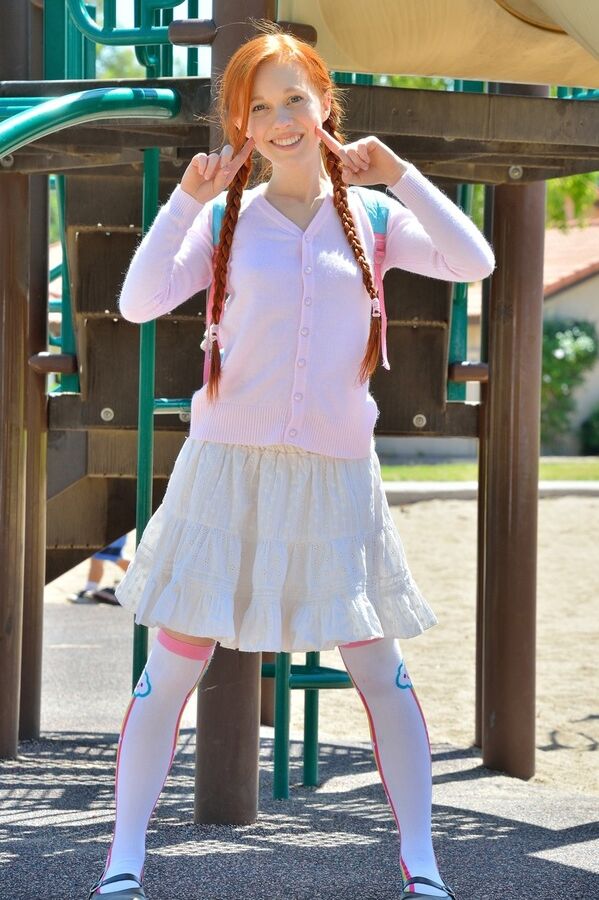 15P Young redhead in pigtails flashes pussy at the playground & toys in socks