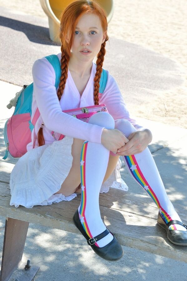 15P Young redhead in pigtails flashes pussy at the playground & toys in socks