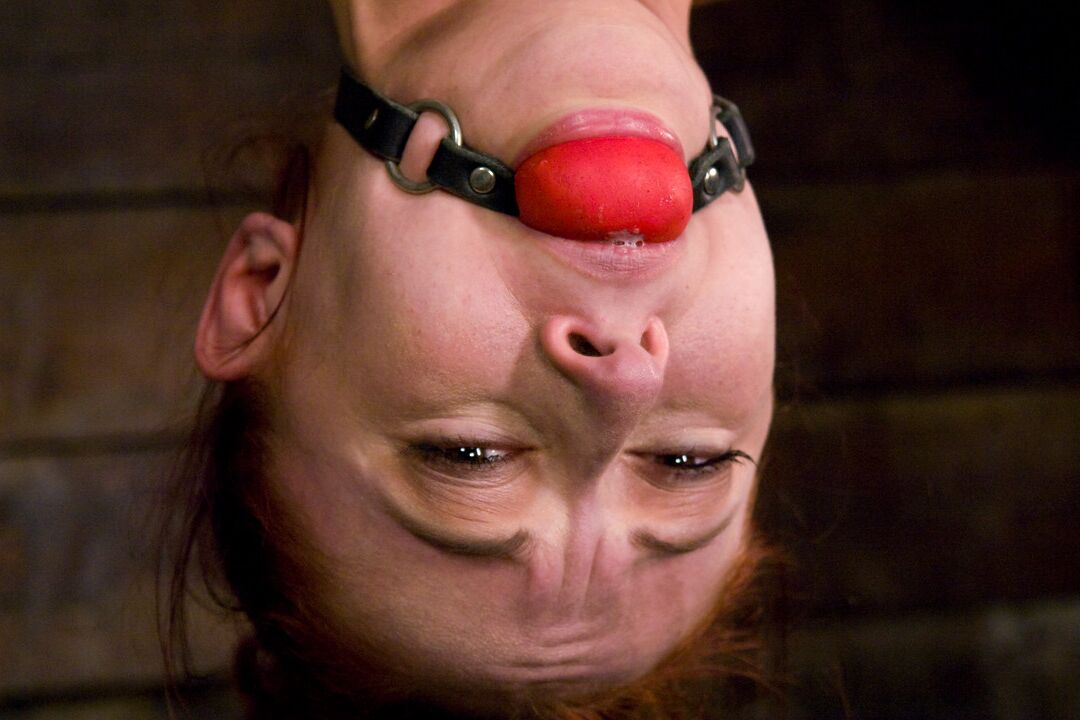 21P Petite MILF Sabrina Sparx gets tortured while being tied up upside down